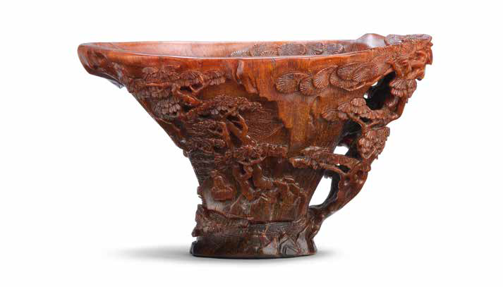 A rare rhinoceros horn 'riverscape' libation cup, 17th century