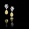 Fine pair of fancy yellow diamond and diamond pendent earrings