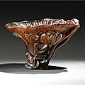 A finely carved rhinoceros horn libation cup, 17th century