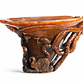 A rare and fine rhinoceros horn 'lotus and egrets' libation cup, 17th century