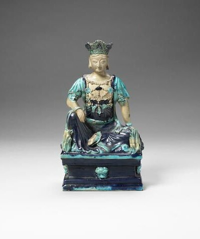 A turquoise and aubergine-glazed figure of Guanyin, Ming Dynasty