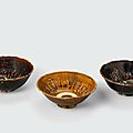 A group of three brown glazed bowls with impressed decoration, Trần-Lê dynasty, 14th-15th century