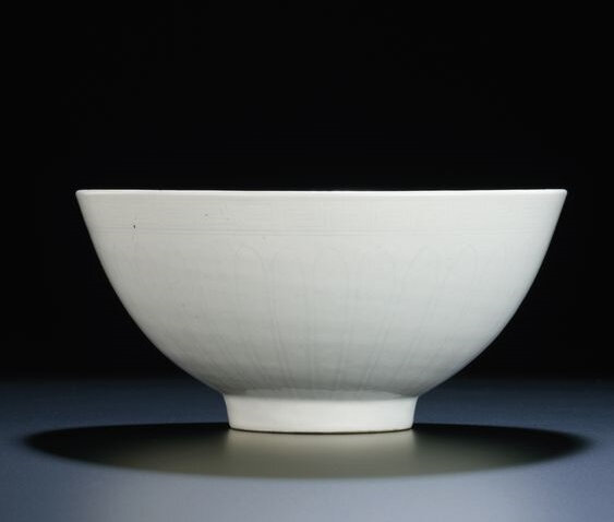 A fine large early Ming white-glazed anhua-decorated bowl, Xuande six-character mark within double-circles and of the period (1426-1435)