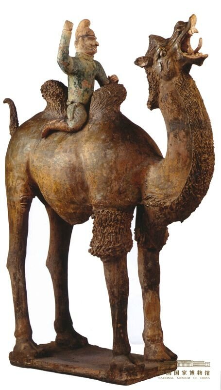 Tomb figurine showing a foreigner on a green glazed camel, Tang (618-907)