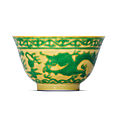 A fine yellow-ground green-enamelled ‘dragon’ bowl, qianlong six-character seal mark in underglaze blue and of the period (1736-