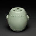 An unusual small celadon-glazed barrel-form incense stick-flower holder, qianlong six-character seal mark