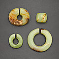 Three jade slit rings and a jade bead, neolithic period, hongshan culture (c. 3800-2700 bc)