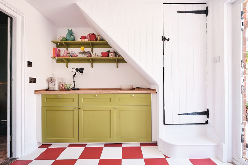 colorful-cottage-kitchen-green-cabinets-red-white-floor-nordroom