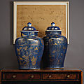 A pair of large gilt-decorated powder blue jars and covers, kangxi period (1662-1722)