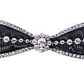 A belle époque platinum and diamond bow brooch by cartier,