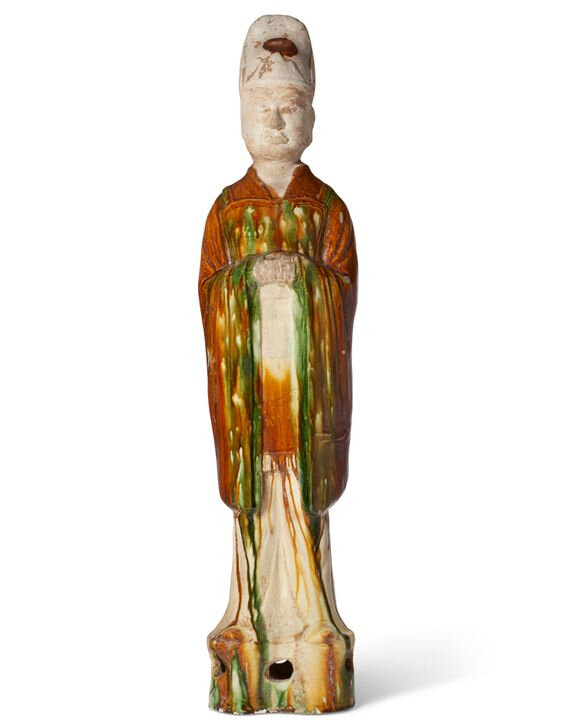 A large sancai-glazed pottery figure of a standing official, Tang dynasty (AD 618-907)