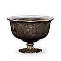 A gilt-silver 'birds and flowers' stem cup, tang dynasty (618-907)