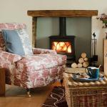 Living-room-with-red-and-white-patterned-armchair-and-stove--Country-Homes--Interiors--Housetohome_co_uk