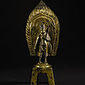 A rare large gilt-bronze votive figure of padmapani, northern wei dynasty, fourth year of the yongping period, 511 ad