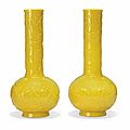 A pair of chinese yellow glass 'dragon' bottle vases, 20th century
