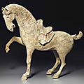 A painted pottery figure of a prancing horse, Tang dynasty (AD 618-907)
