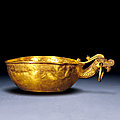 A gold bowl with a dragon handle, yi, song dynasty (960-1279)