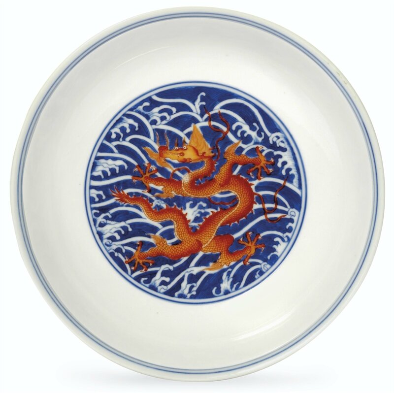 An iron-red-decorated blue and white 'dragon' dish, Qianlong six-character seal mark in underglaze blue and of the period (1736-1795)