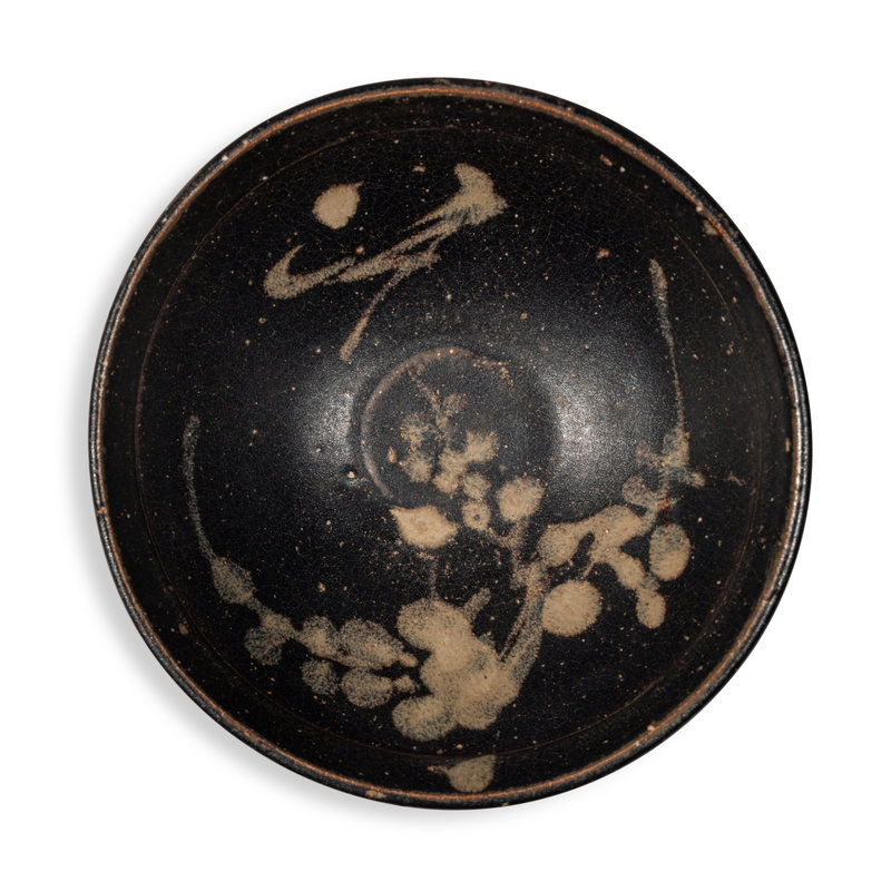 A painted 'Jizhou' black-glazed 'prunus' bowl, Southern Song dynasty (1127-1279)