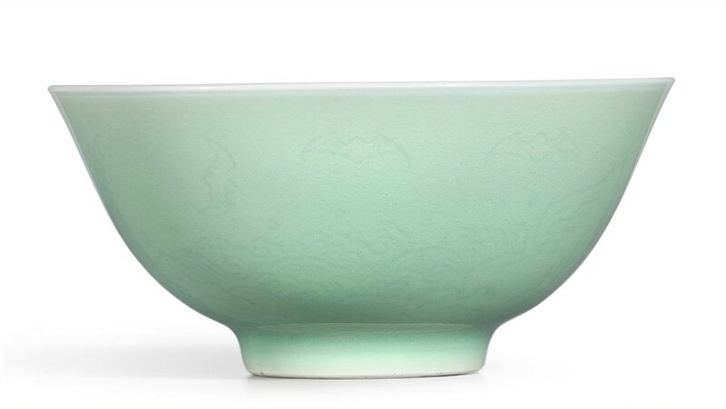 A fine celadon-glazed incised 'bats and waves' bowl, Mark and period of Yongzheng (1723-1735)