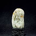 A superbly carved pale celadon jade boulder, qianlong period (1736-1795)