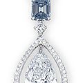 A coloured diamond and diamond pendent necklace