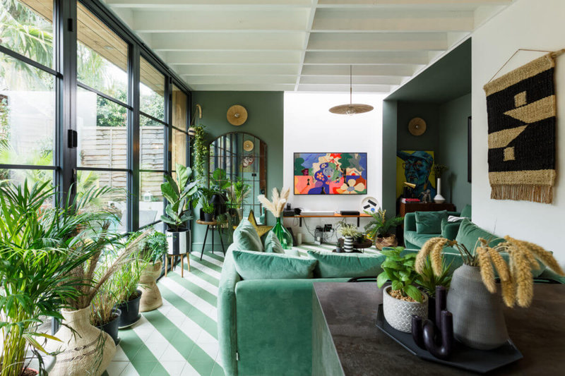 open-plan-kitchen-sitting-room-diagonal-green-white-floor-tiles-plants-nordroom