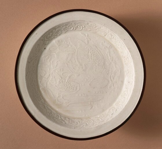A rare small Ding moulded ‘Mandarin Ducks’ dish, Jin dynasty (11151234