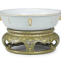 A exceptionally rare imperial revolving pale-green-glazed bowl on gilt and silver teadust-glazed stand qianlong seal mark and of