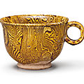 An amber-glazed marbled pottery cup, Tang dynasty (618-907)