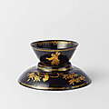 A böttger stoneware black-glazed and gilt teabowl and saucer, 1711-15
