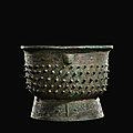 An archaic bronze ritual food vessel (gui), late shang dynasty 