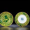 A fine pair of yellow-ground green-enamelled 'dragon' foliate dishes, qianlong six-character seal marks and of the period 