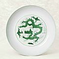 A fine and rare incised green-enamelled 'Dragon' dish, Hongzhi six-character mark within double circles and of the period (1488-1505)