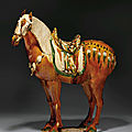 An important massive sancai-glazed pottery figure of a Fereghan horse, Tang dynasty (618-907)