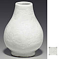 An unusual miniature white-glazed hu-form vase, qianlong four-character incised seal mark and of the period (1736-1795)