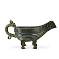 An inscribed archaic bronze pouring vessel, yi, zhou dynasty (1050-221 bc)